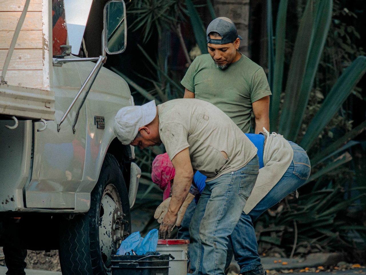 Grounds crew loading equipment during a landscaping route